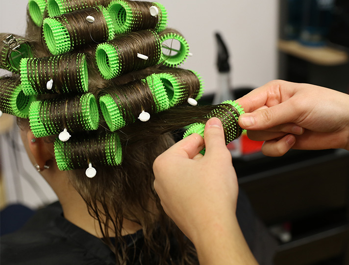 Student styling hair