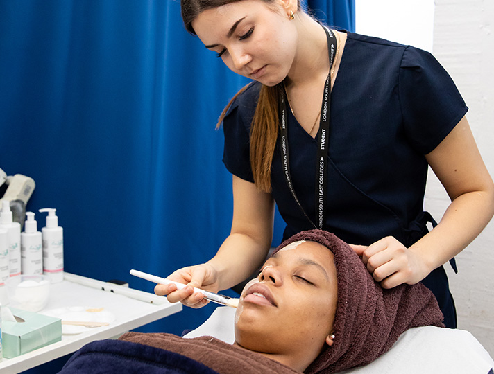 Student doing a facial on a client